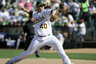 OAKLAND, CA: Andrew Bailey #40 of the Oakland Athletics  pitches against the Seattle Mariners in the ninth inning during an MLB baseball game at O.co Coliseum in Oakland, California. The Athletics won the game 8-5. (Photo by Thearon W. Henderson/Getty Images)