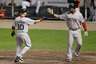 BALTIMORE, MD: Marco Scutaro #10 of the Boston Red Sox is congratulated by Carl Crawford #13 (R) after driving him in on a two RBI home run during the sixth inning against the Baltimore Orioles at Oriole Park at Camden Yards in Baltimore, Maryland.  (Photo by Rob Carr/Getty Images)