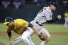 OAKLAND, CA : Chris Stewart #37 of the San Francisco Giants heads home on a throwing error by Guillermo Moscoso #52 of the Oakland Athletics in the fifth inning during a MLB baseball game at the Oakland-Alameda County Coliseum in Oakland, California. (Photo by Thearon W. Henderson/Getty Images)