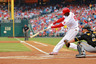 Domonic Brown of the Philadelphia Phillies hits for a base hit in the first inning against the Pittsburgh Pirates at Citizens Bank Park in Philadelphia, Pennsylvania.  (Photo by Len Redkoles/Getty Images)