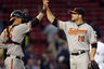 Boston, MA, USA; Baltimore Orioles first baseman Chris Davis celebrates with catcher Matt Wieters after defeating the Boston Red Sox 9-6 in 17th innings at Fenway Park. Credit: Greg M. Cooper-US PRESSWIRE