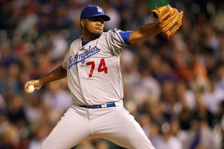 May 1, 2012; Denver, CO, USA; Los Angeles Dodgers pitcher Kenley Jansen (74) delivers a pitch during the eighth inning against the Colorado Rockies at Coors Field. Mandatory Credit: Chris Humphreys-US PRESSWIRE