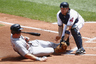 Lou Marson of the Cleveland Indians tags out Brennan Boesch of the Detroit Tigers at the plate during their game at Progressive Field in Cleveland, Ohio.  (Photo by John Grieshop/Getty Images)