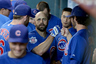 HOUSTON,TX: Reed Johnson of the Chicago Cubs is congratulated by teammates in the dugout after he hit a solo homerun in the first inning against Wandy Rodriguez of the Houston Astros at Minute Maid Park in Houston, Texas.(Photo by Thomas B. Shea/Getty Images)