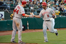 OAKLAND, CA:  Albert Pujols of the Los Angeles Angels of Anaheim is congatulated by Mark Trumbo after hitting a solo home run in the third inning against the Oakland Athletics at O.co Coliseum in Oakland, California.  (Photo by Thearon W. Henderson/Getty Images)
