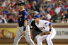 First baseman Mike Olt of the Texas Rangers shares a laugh with Joe Mauer the Minnesota Twins at the Rangers Ballpark in Arlington in Arlington, Texas. (Photo by Layne Murdoch/Getty Images)
