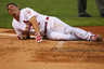 Lance Berkman of the St. Louis Cardinals reacts after being hit by a pitch against the Los Angeles Dodgers at Busch Stadium in St. Louis, Missouri.  (Photo by Dilip Vishwanat/Getty Images)