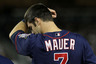 NEW YORK - OCTOBER 09:  Joe Mauer #7 of the Minnesota Twins wipes his forehead against the New York Yankees during Game Three of the ALDS part of the 2010 MLB Playoffs at Yankee Stadium on October 9, 2025 in the Bronx borough of New York City.  (Photo by Jim McIsaac/Getty Images)